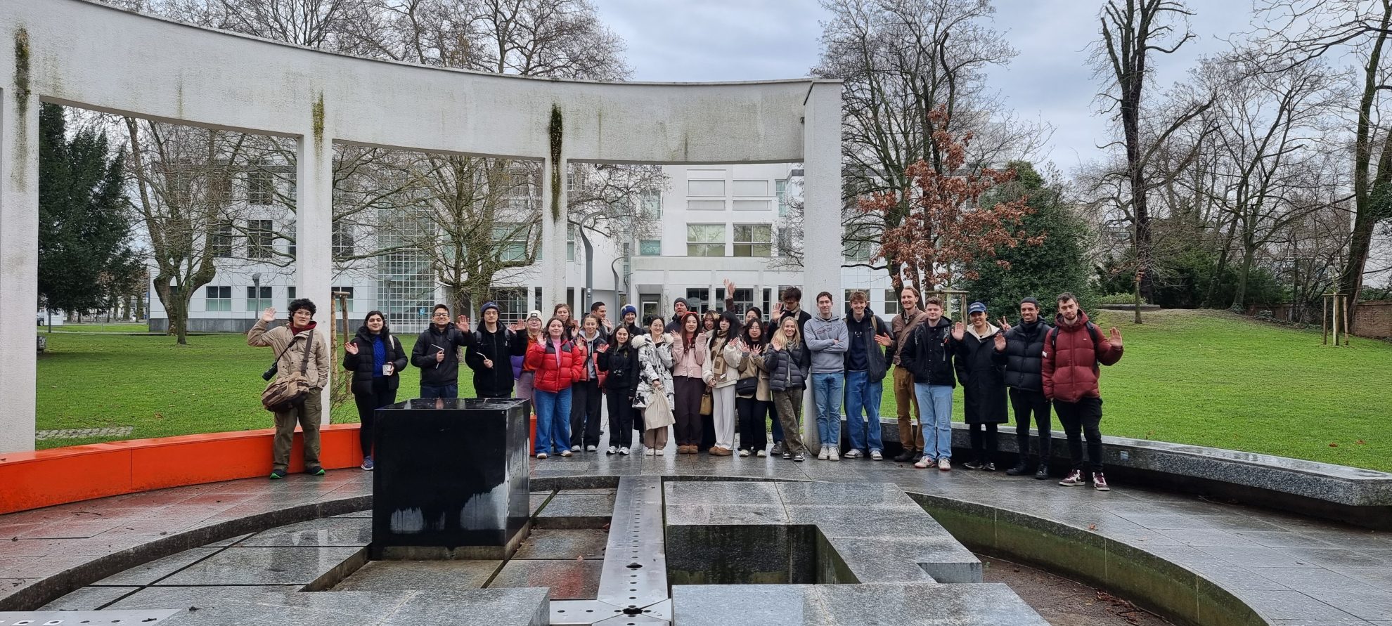 Group of students standing outside in a circular concrete structure