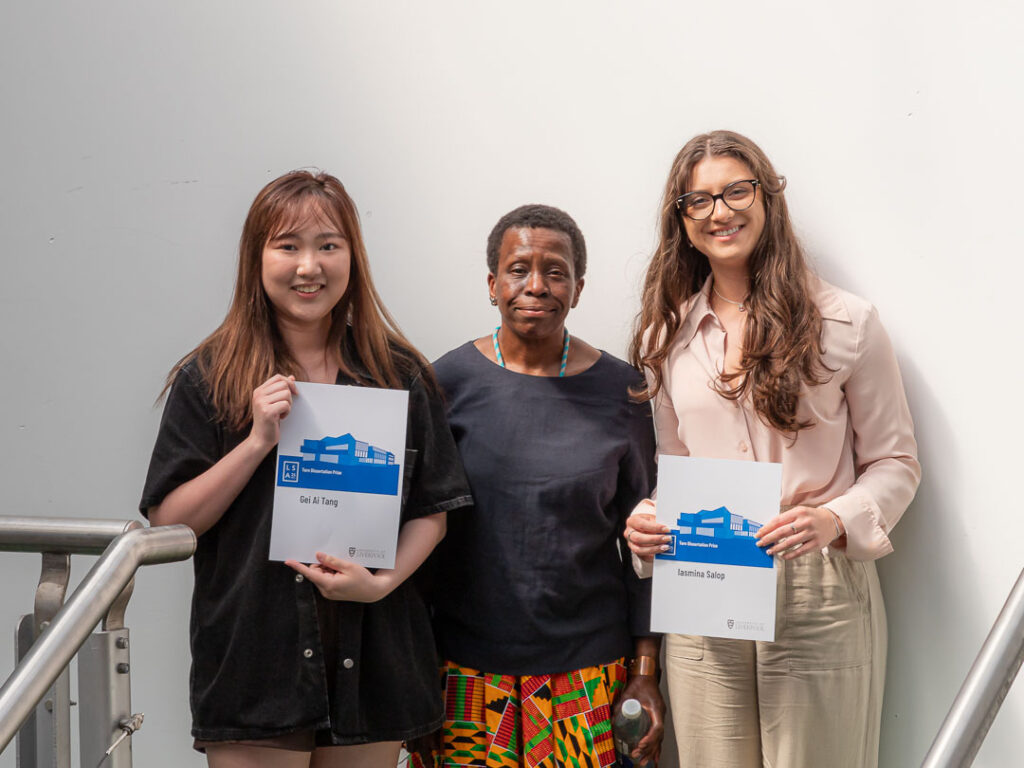 Gei Ai Tang and Iasmina Salop are awarded the Tarn Dissertation Prize by Professor Ola Uduku